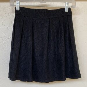 The Shew Lace Pleated Mini Skirt